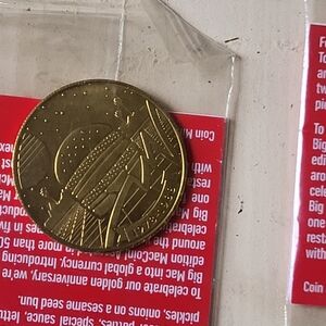 McDonald's Gold Coin with Red Background
